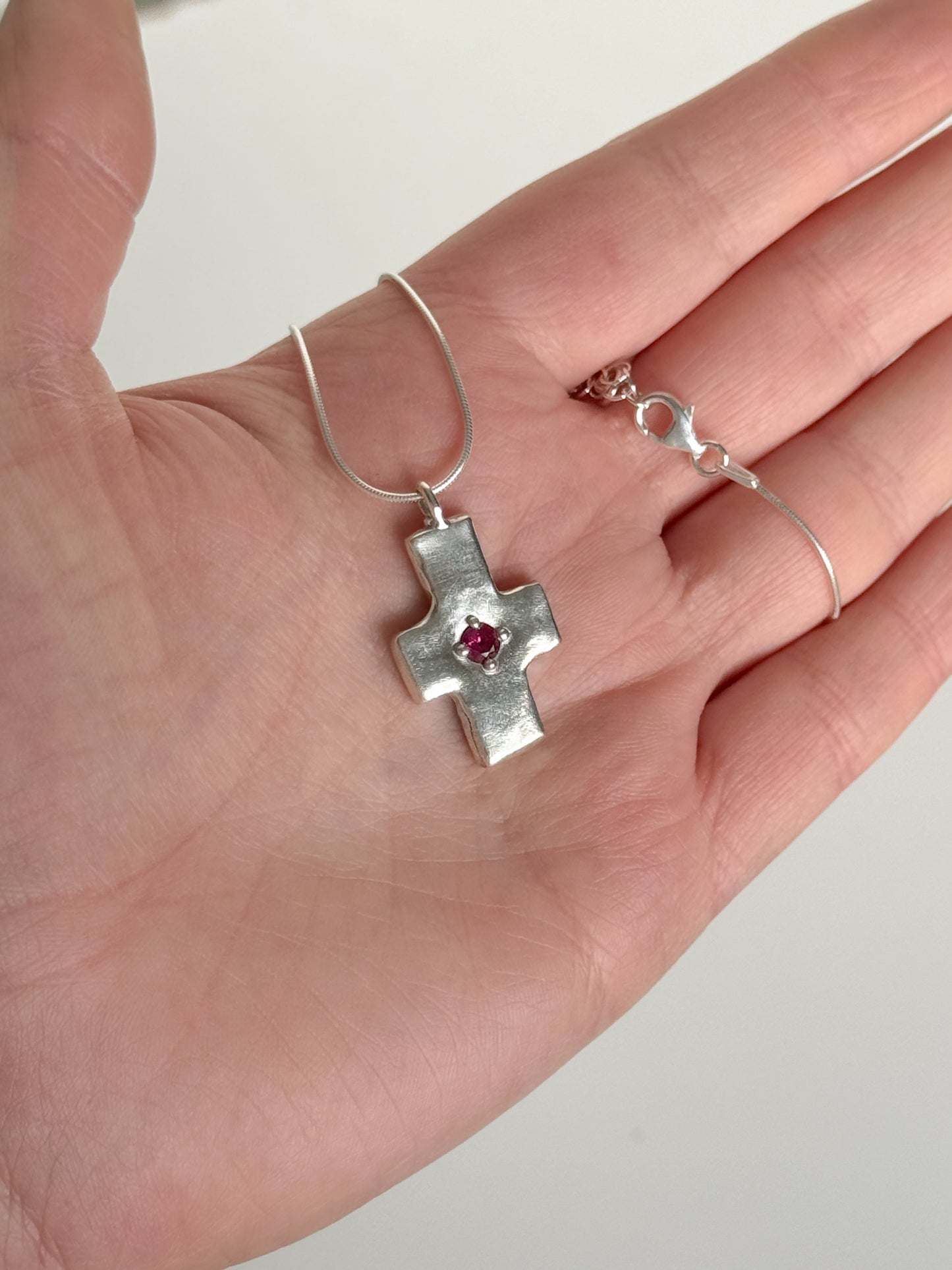 Pink sapphire cross necklace