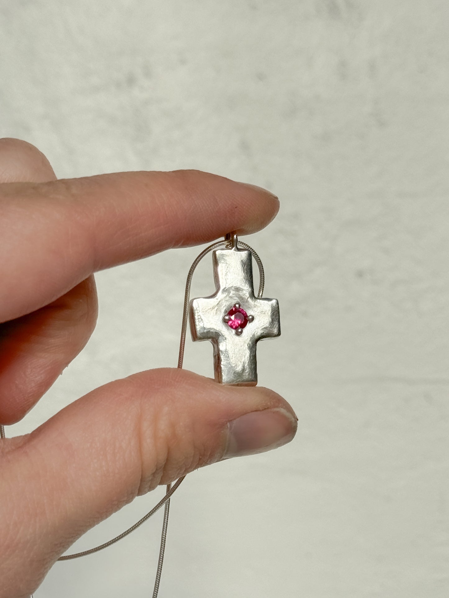 Pink sapphire cross necklace