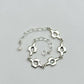 Quatrefoil link bracelet